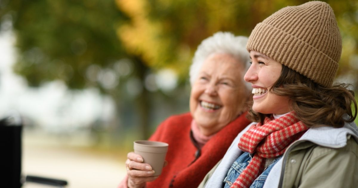 caregiver spending time with a senior outside