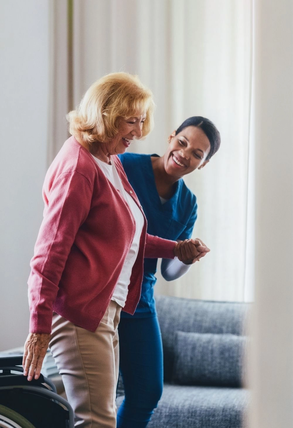 caregiver helping senior walk