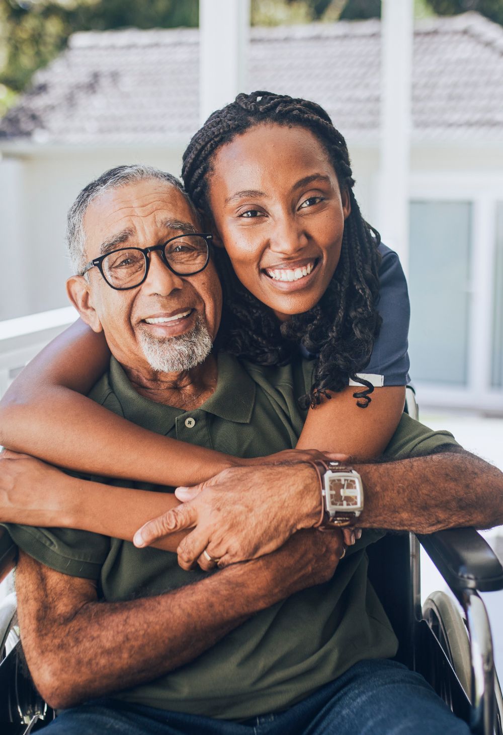 caregiver hugging senior