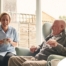 A caregiver provides Memory Care at Home to a senior